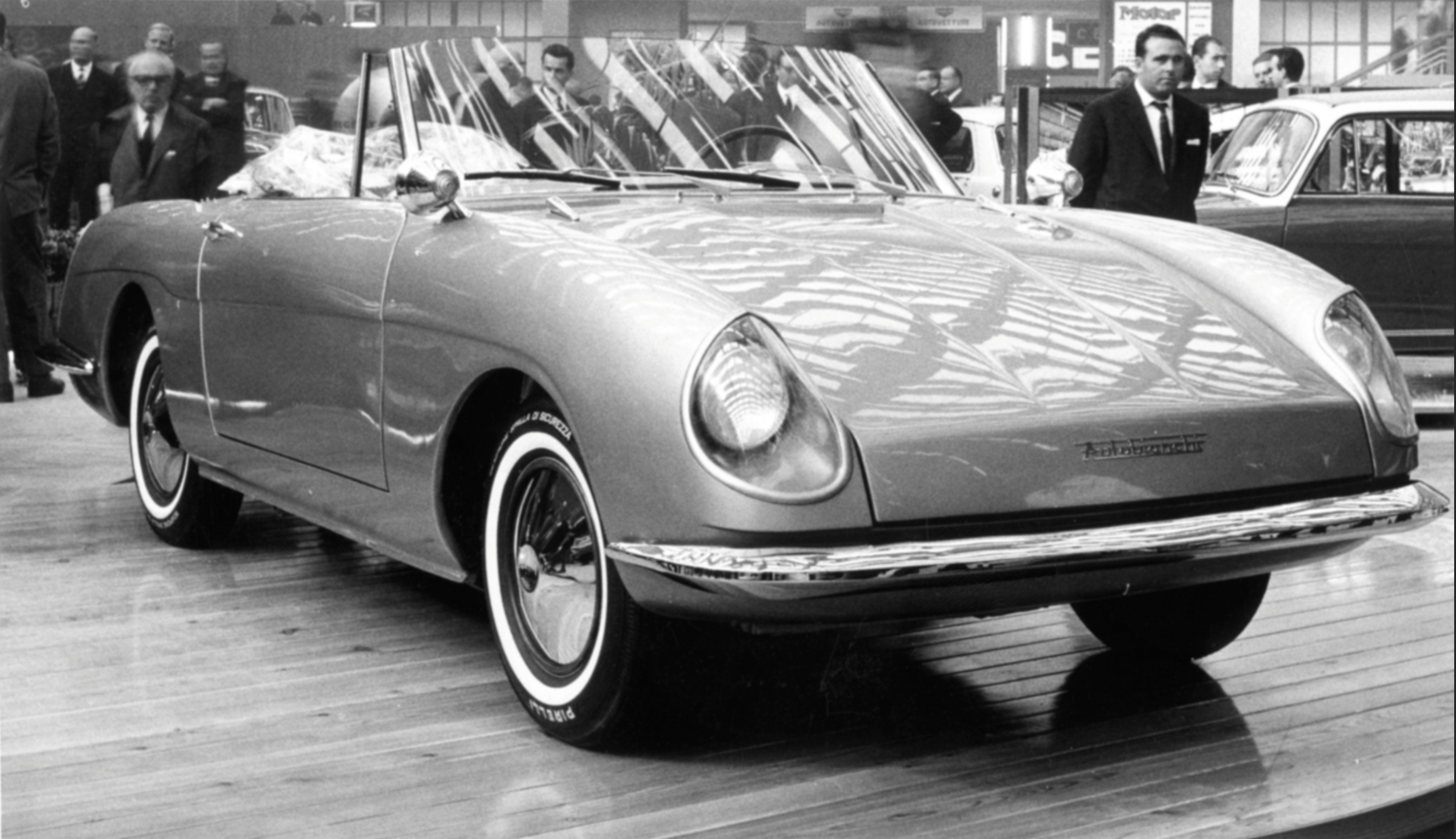 Autobianchi Stellina at motor show — front three-quarter with visitors